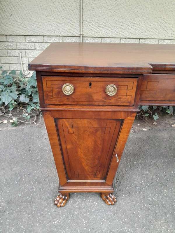 An 18th / 19th Century William IV Mahogany Sideboard With Ebony Inlay And Original Lion Claw Feet...
