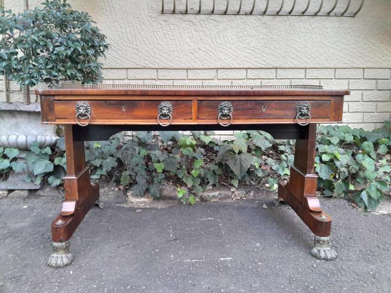 A 19th Century William IV Rosewood Desk with Gilt Tooled Leather and Gilt Metal Gallery Top on Br...