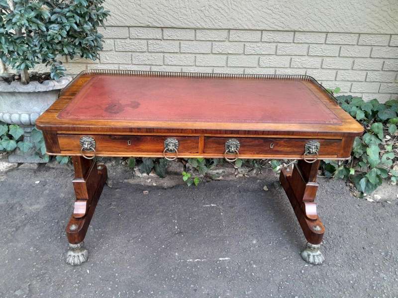 A 19th Century William IV Rosewood Desk with Gilt Tooled Leather and Gilt Metal Gallery Top on Br...