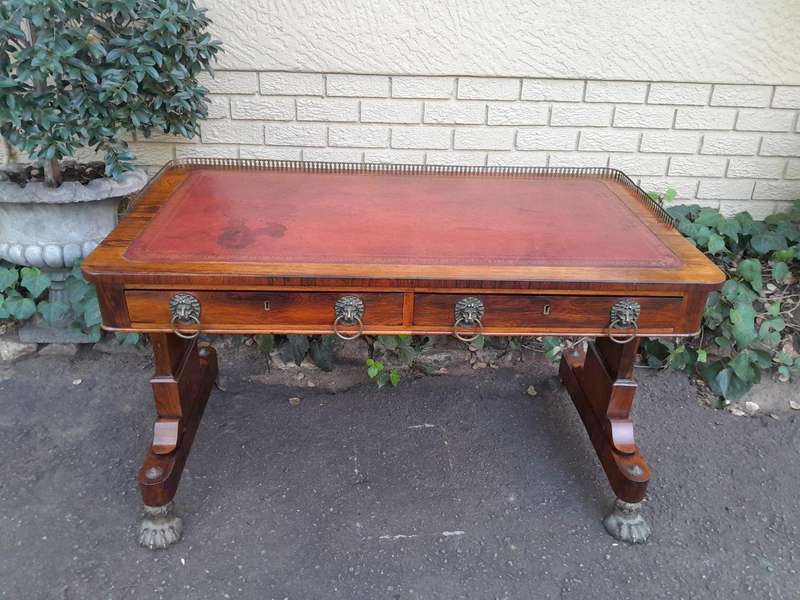 A 19th Century William IV Rosewood Desk with Gilt Tooled Leather and Gilt Metal Gallery Top on Br...