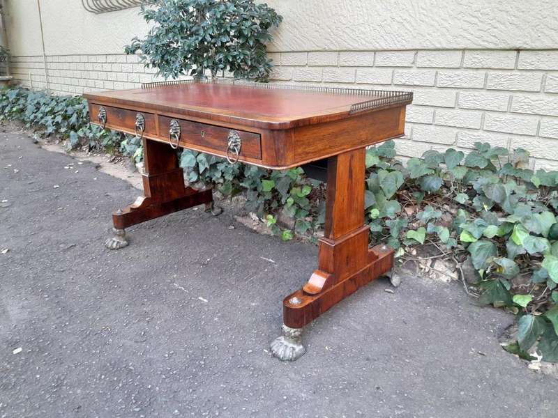 A 19th Century William IV Rosewood Desk with Gilt Tooled Leather and Gilt Metal Gallery Top on Br...