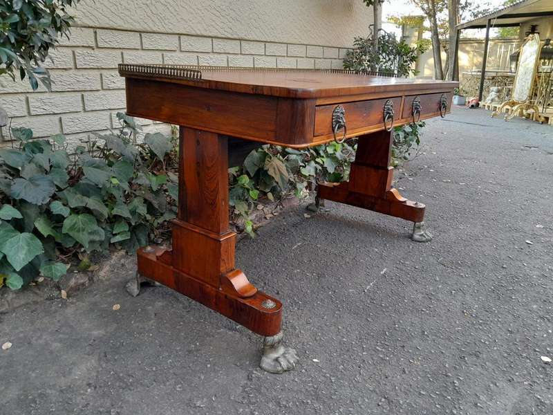 A 19th Century William IV Rosewood Desk with Gilt Tooled Leather and Gilt Metal Gallery Top on Br...