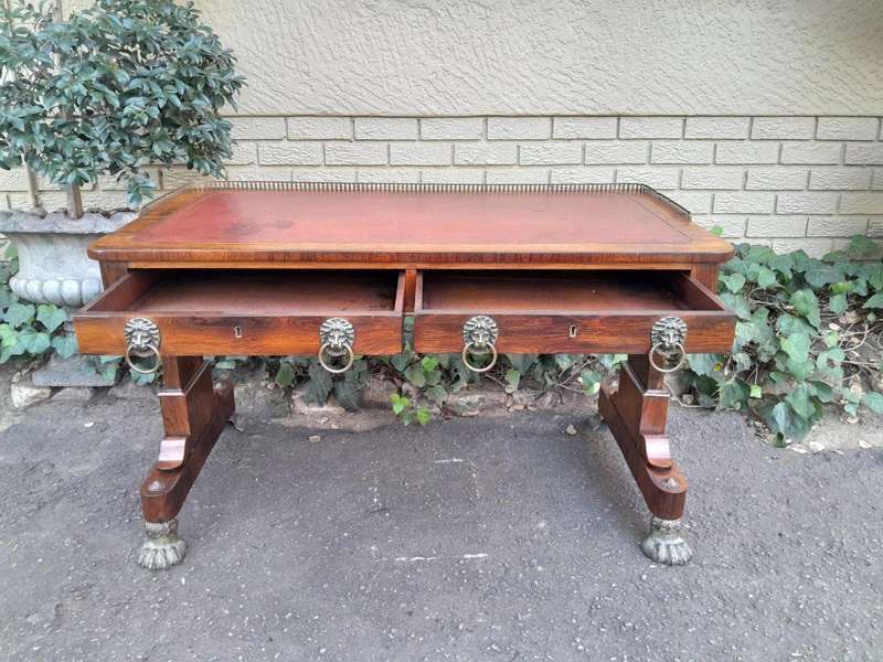 A 19th Century William IV Rosewood Desk with Gilt Tooled Leather and Gilt Metal Gallery Top on Br...