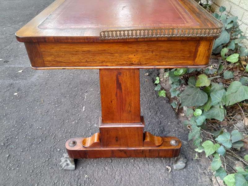 A 19th Century William IV Rosewood Desk with Gilt Tooled Leather and Gilt Metal Gallery Top on Br...