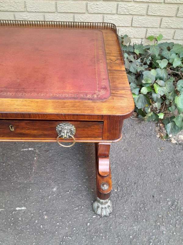 A 19th Century William IV Rosewood Desk with Gilt Tooled Leather and Gilt Metal Gallery Top on Br...