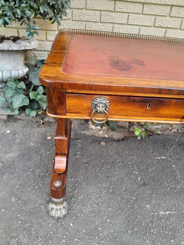 A 19th Century William IV Rosewood Desk with Gilt Tooled Leather and Gilt Metal Gallery Top on Br...