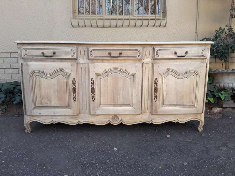 A 20TH Century French Walnut Sideboard with Original Iron hinges in a Contemporary Bleached Finish