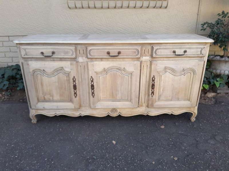 A 20TH Century French Walnut Sideboard with Original Iron hinges in a Contemporary Bleached Finish