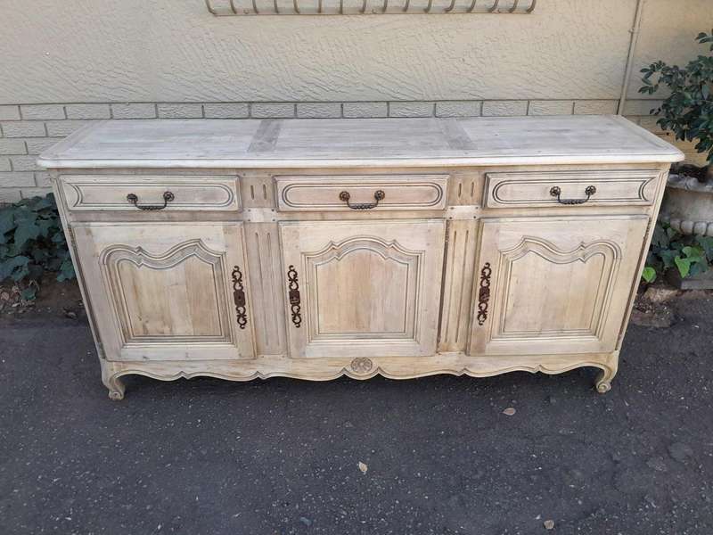 A 20TH Century French Walnut Sideboard with Original Iron hinges in a Contemporary Bleached Finish