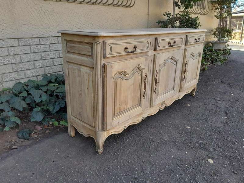 A 20TH Century French Walnut Sideboard with Original Iron hinges in a Contemporary Bleached Finish