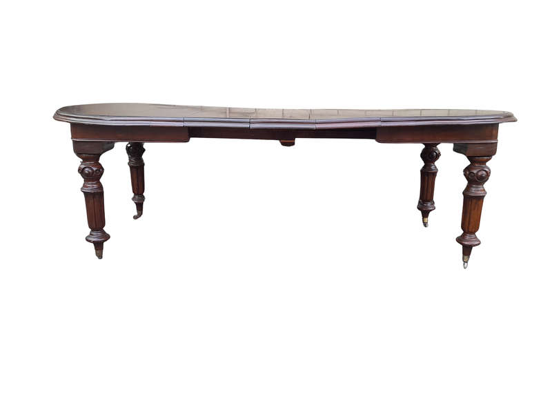 A 19th Century Antique Victorian Mahogany Extending Dining Table with Heavily Carved Legs on Bras...