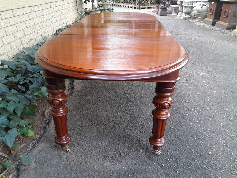 A 19th Century Antique Victorian Mahogany Extending Dining Table with Heavily Carved Legs on Bras...