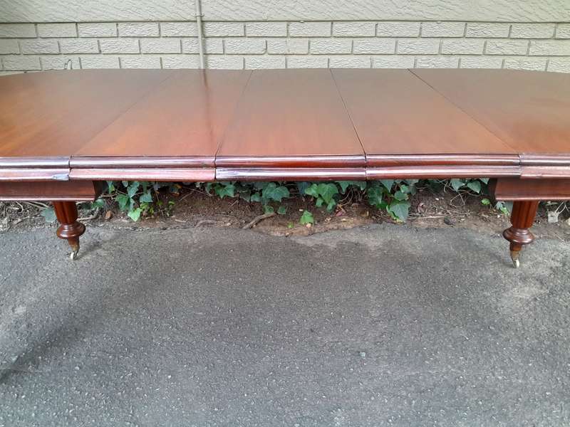 A 19th Century Antique Victorian Mahogany Extending Dining Table with Heavily Carved Legs on Bras...
