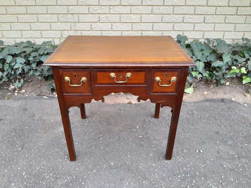 An 18th/ 19th Century Georgian Oak and Mahogany Lowboy with Drawers and Brass Handles
