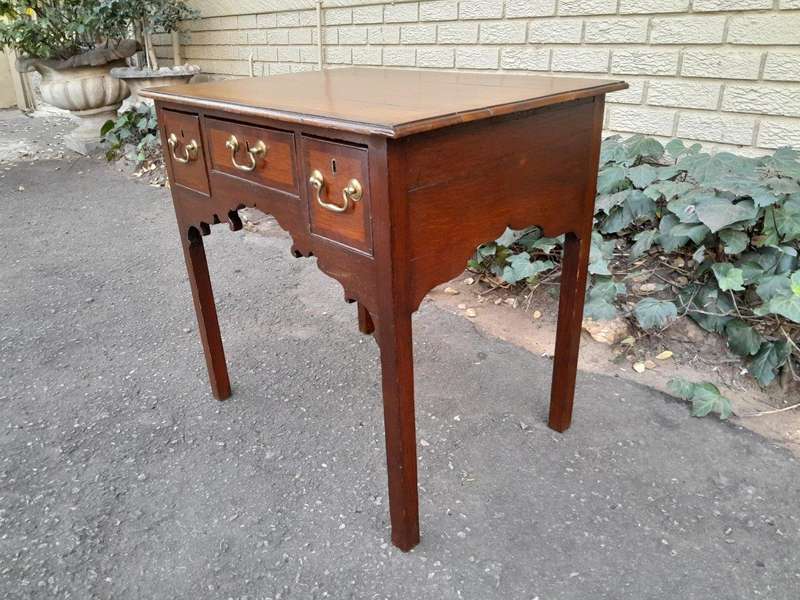 An 18th/ 19th Century Georgian Oak and Mahogany Lowboy with Drawers and Brass Handles