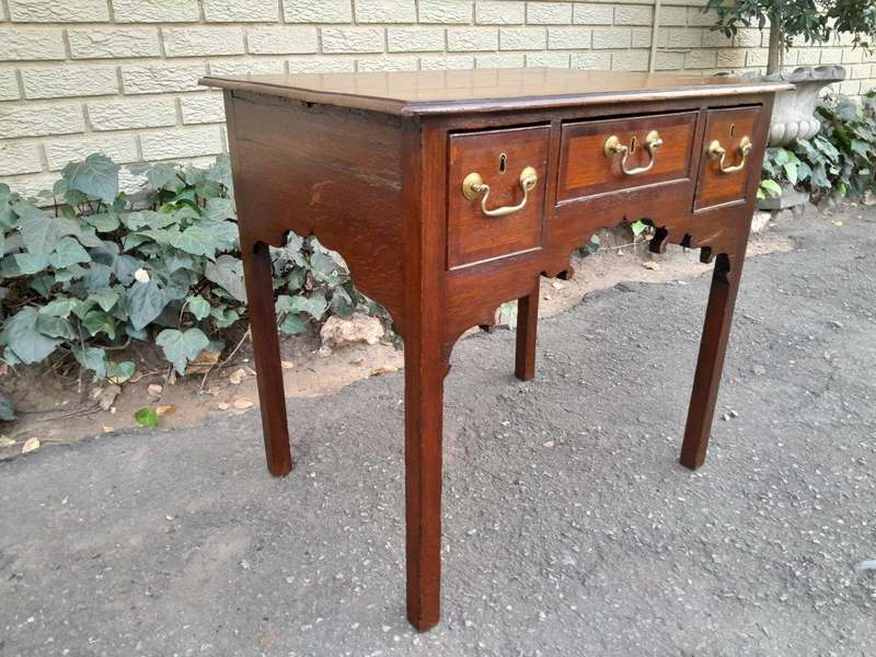 An 18th/ 19th Century Georgian Oak and Mahogany Lowboy with Drawers and Brass Handles