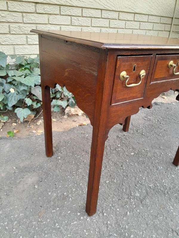 An 18th/ 19th Century Georgian Oak and Mahogany Lowboy with Drawers and Brass Handles
