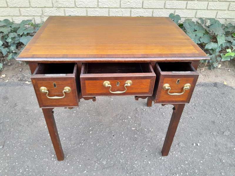 An 18th/ 19th Century Georgian Oak and Mahogany Lowboy with Drawers and Brass Handles