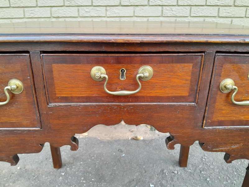 An 18th/ 19th Century Georgian Oak and Mahogany Lowboy with Drawers and Brass Handles