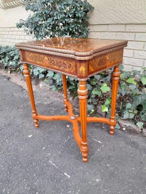 A 20th Century French Style Walnut and Gilt Metal  Games Table with Tooled Leather Top