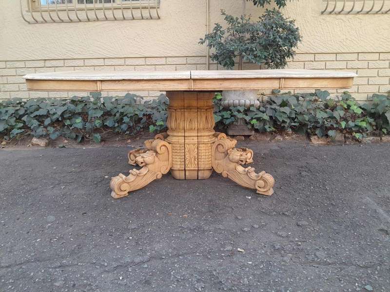 A 19th Century Heavily Carved Oak Extending Table  With Three Extensions