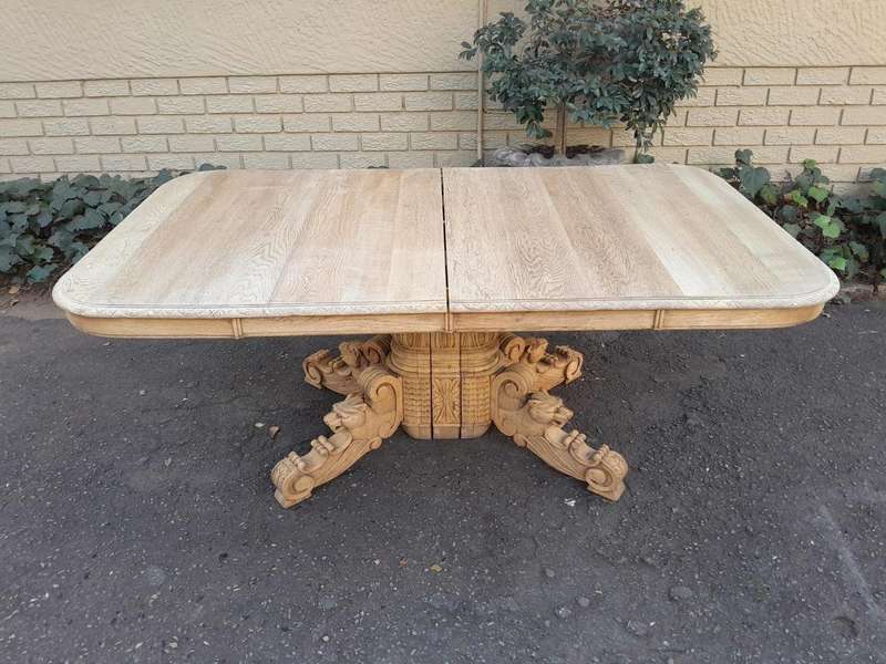 A 19th Century Heavily Carved Oak Extending Table  With Three Extensions