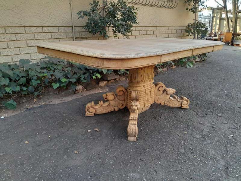A 19th Century Heavily Carved Oak Extending Table  With Three Extensions