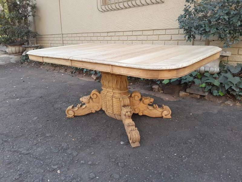 A 19th Century Heavily Carved Oak Extending Table  With Three Extensions