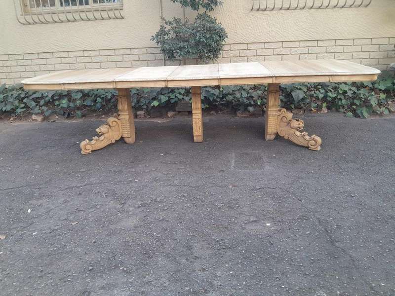 A 19th Century Heavily Carved Oak Extending Table  With Three Extensions