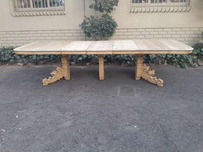 A 19th Century Heavily Carved Oak Extending Table  With Three Extensions
