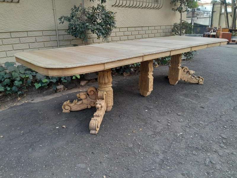 A 19th Century Heavily Carved Oak Extending Table  With Three Extensions