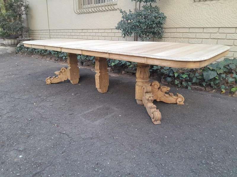 A 19th Century Heavily Carved Oak Extending Table  With Three Extensions