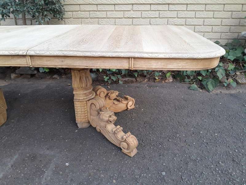 A 19th Century Heavily Carved Oak Extending Table  With Three Extensions