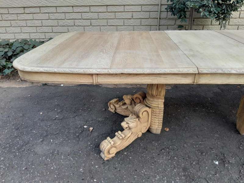 A 19th Century Heavily Carved Oak Extending Table  With Three Extensions