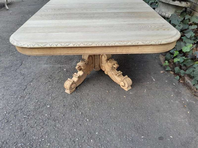 A 19th Century Heavily Carved Oak Extending Table  With Three Extensions