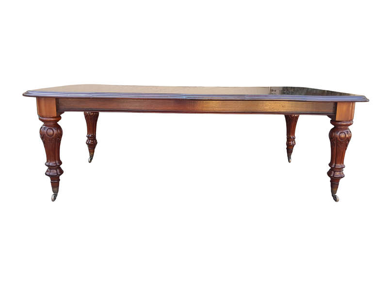 A Late 19th Century Victorian Mahogany Dining Table on Heavily Carved Legs and Original Castors