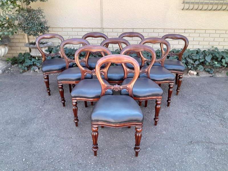 An Early 20th Century Victorian Set Of Ten Bustle Back Chairs Upholstered In Deep Button Leather