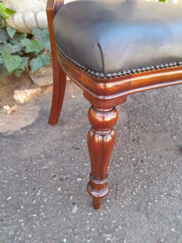 An Early 20th Century Victorian Set Of Ten Bustle Back Chairs Upholstered In Deep Button Leather