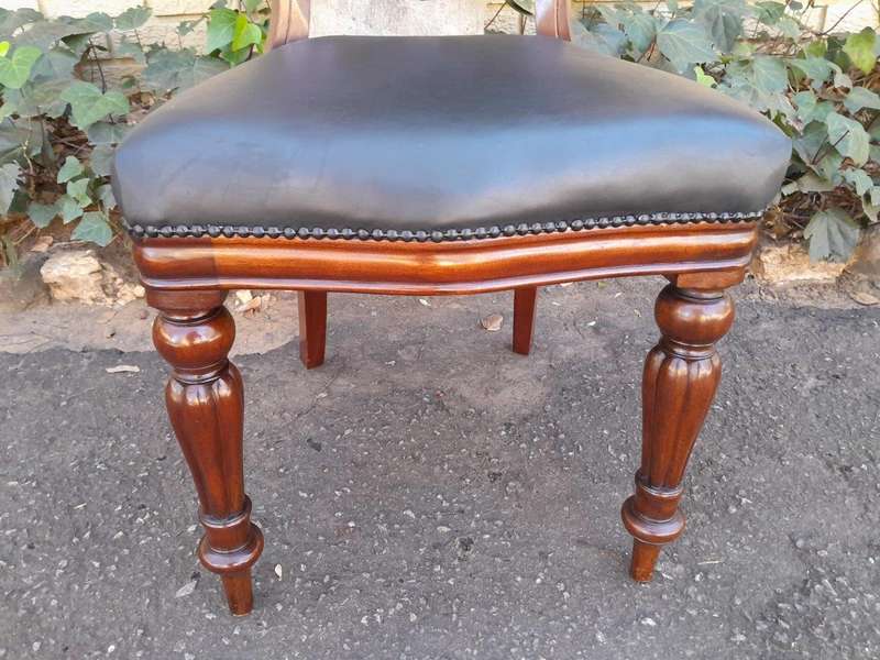 An Early 20th Century Victorian Set Of Ten Bustle Back Chairs Upholstered In Deep Button Leather