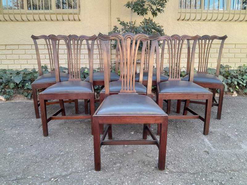 A 20th Century Set Of  Eight Carved Mahogany George Lll Style Dining Chairs Upholstered In Leather