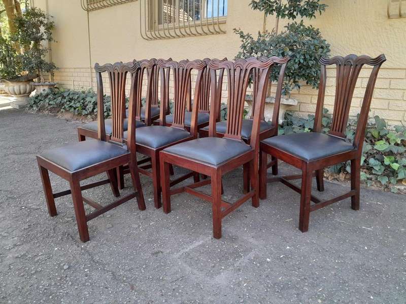 A 20th Century Set Of  Eight Carved Mahogany George Lll Style Dining Chairs Upholstered In Leather