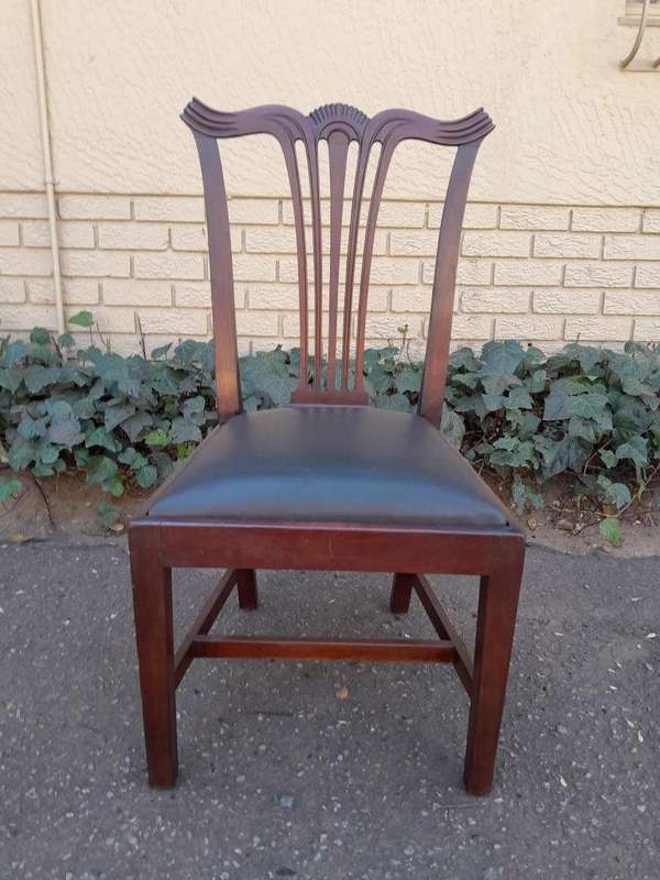 A 20th Century Set Of  Eight Carved Mahogany George Lll Style Dining Chairs Upholstered In Leather