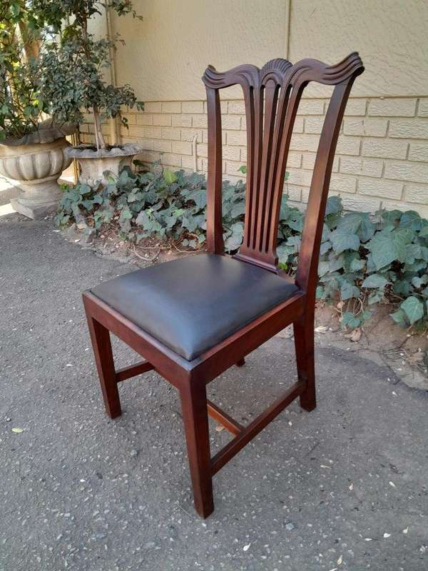 A 20th Century Set Of  Eight Carved Mahogany George Lll Style Dining Chairs Upholstered In Leather