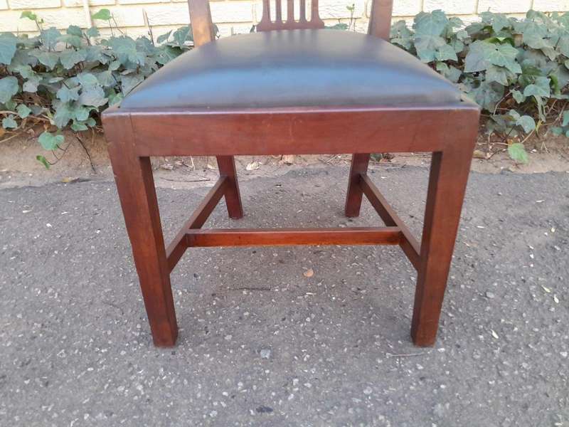 A 20th Century Set Of  Eight Carved Mahogany George Lll Style Dining Chairs Upholstered In Leather