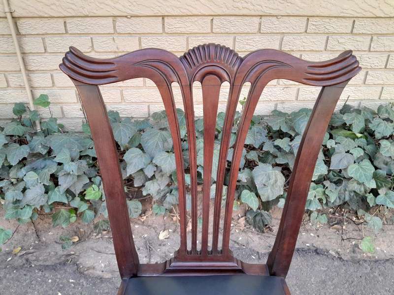 A 20th Century Set Of  Eight Carved Mahogany George Lll Style Dining Chairs Upholstered In Leather