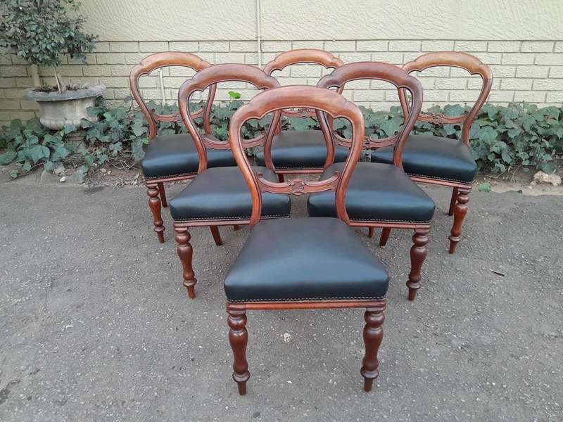 An Antique Set Of Six Victorian Carved Walnut Dining Chairs Upholstered In Leather