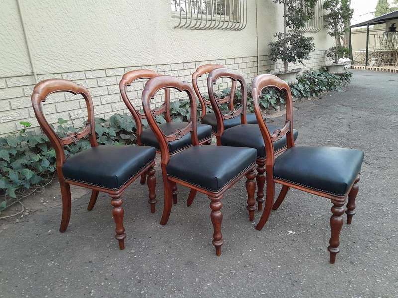 An Antique Set Of Six Victorian Carved Walnut Dining Chairs Upholstered In Leather