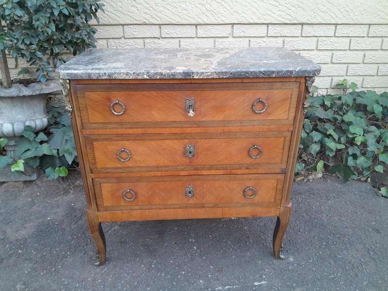 An Antique Kingswood and Gilt Metal Mounted Chest of Drawers with Marble Top