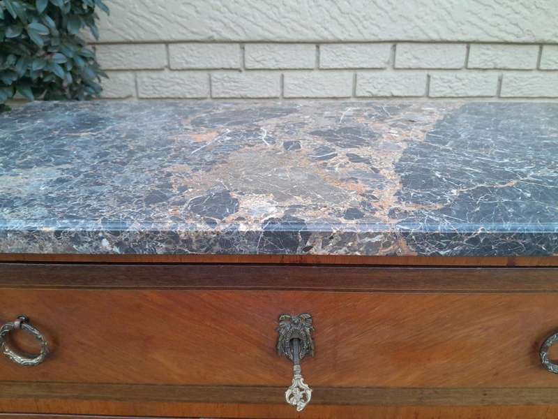 An Antique Kingswood and Gilt Metal Mounted Chest of Drawers with Marble Top
