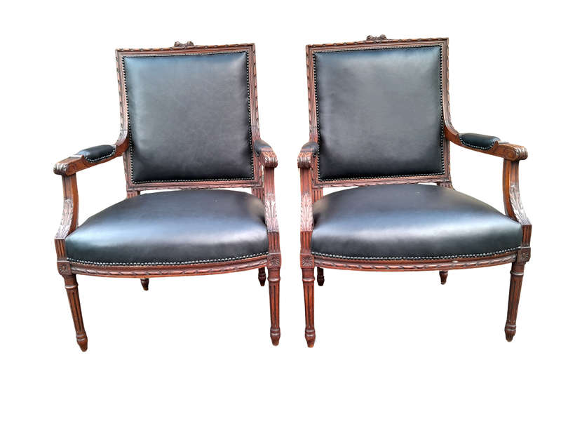 A 19th Century French Pair of Carved Walnut Armchairs Upholstered in  Leather